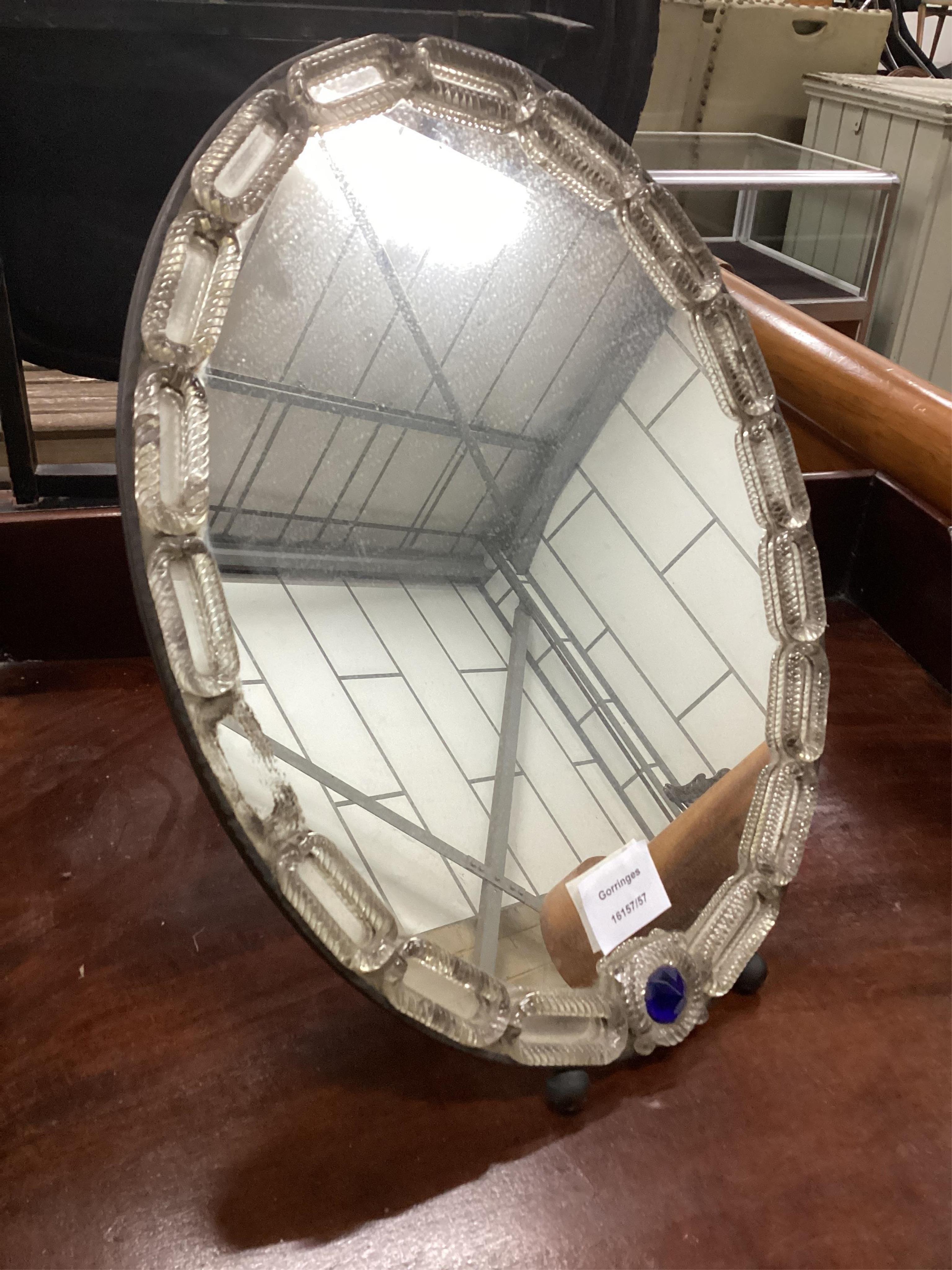 A 19th century Venetian oval strut dressing table mirror, width 32cm, height 42cm. Condition - fair but lacks one oval glass boss to left side